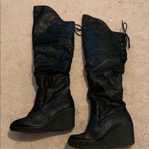 Black over the knee wedge boots